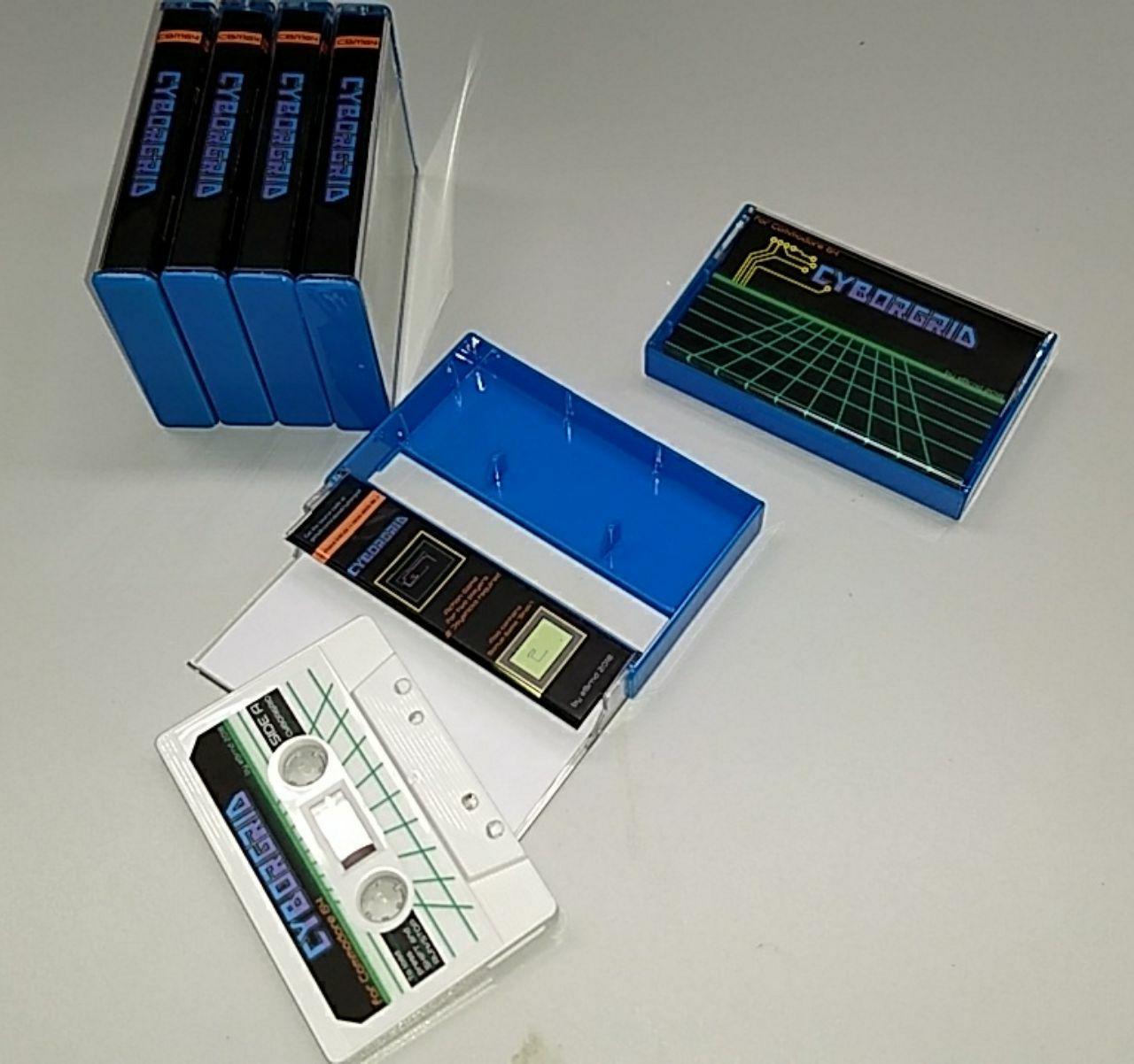 Cassettes with the game Cyborgrid on them with colorful labels.