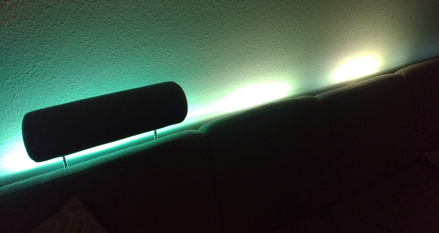 A picture of my sofa with colorful light shining up from beind the backrest